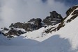 Durante la salita alla sella di 2250 m il Torrione di Mezzaluna sul versante NE.